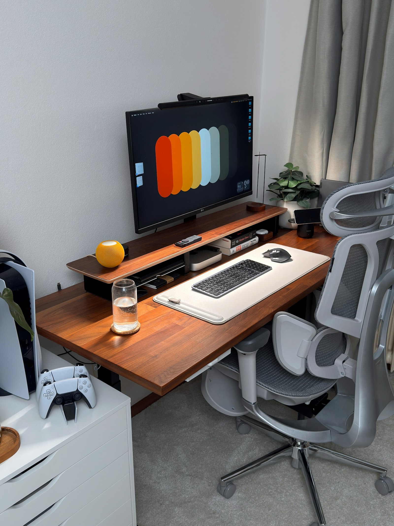 Modern gaming desk with console and monitor used for patch-day reruns